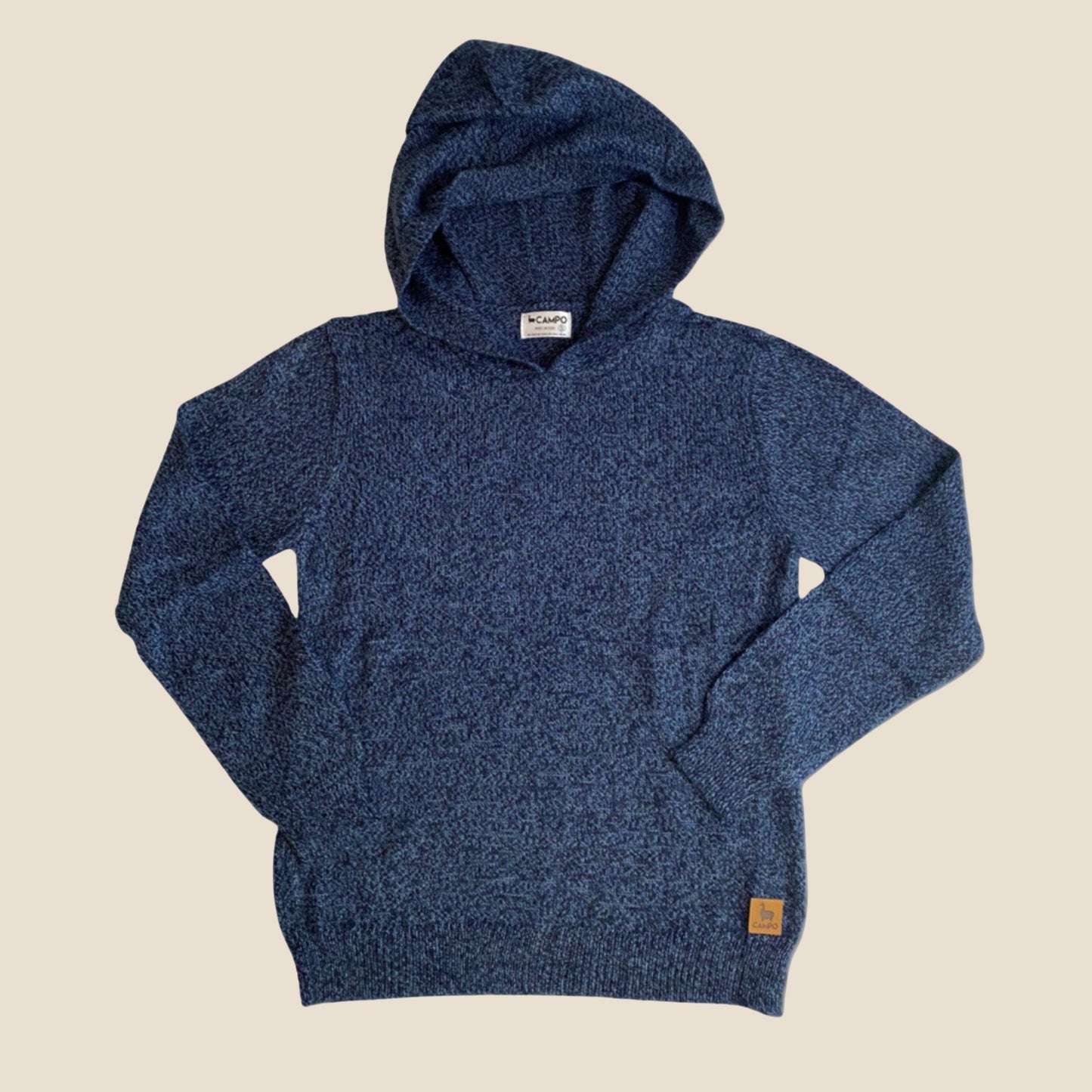 Blue hoodie on a beige background