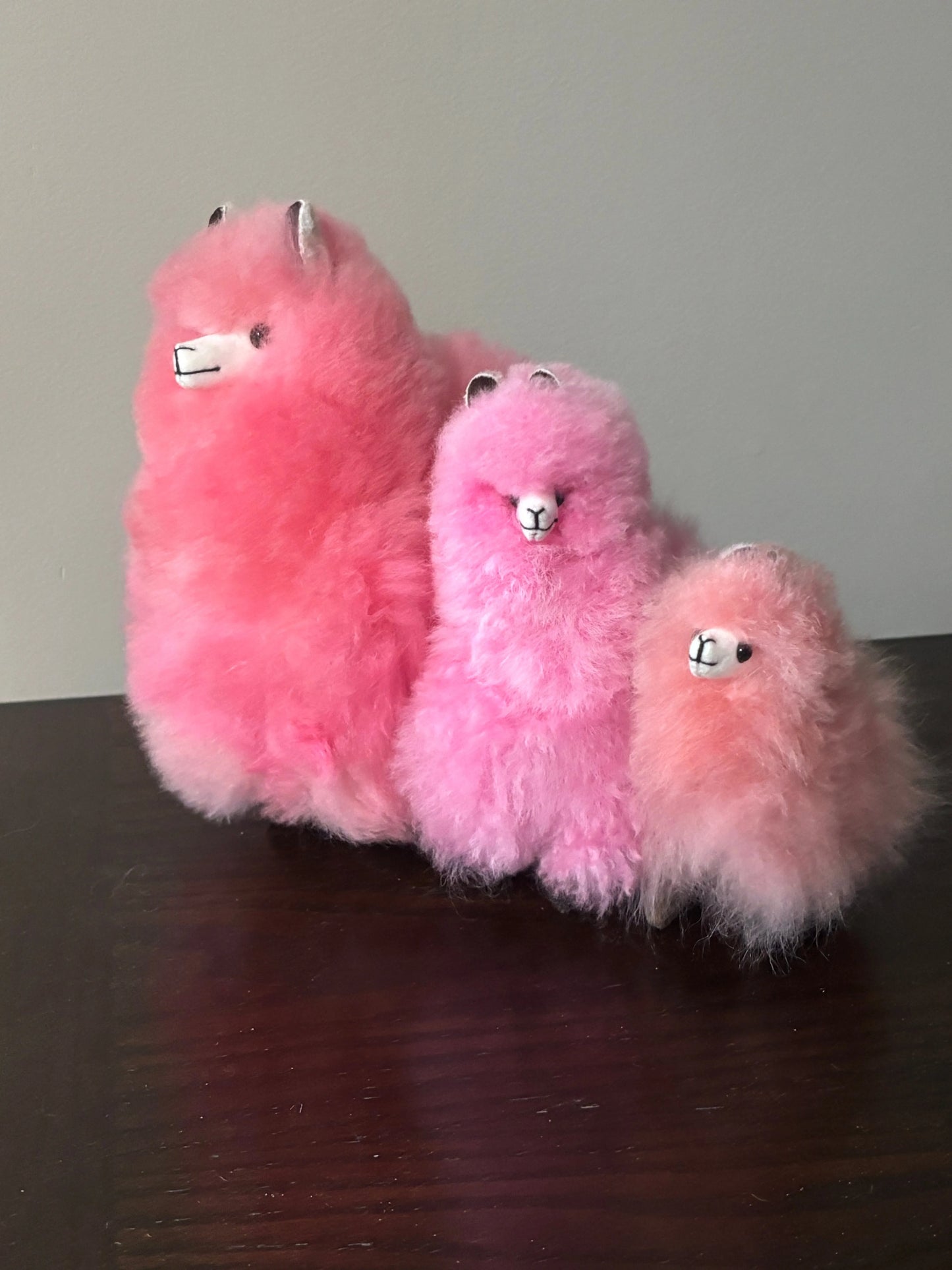 3 sizes of pink alpaca fluffies: Small, Medium, Large