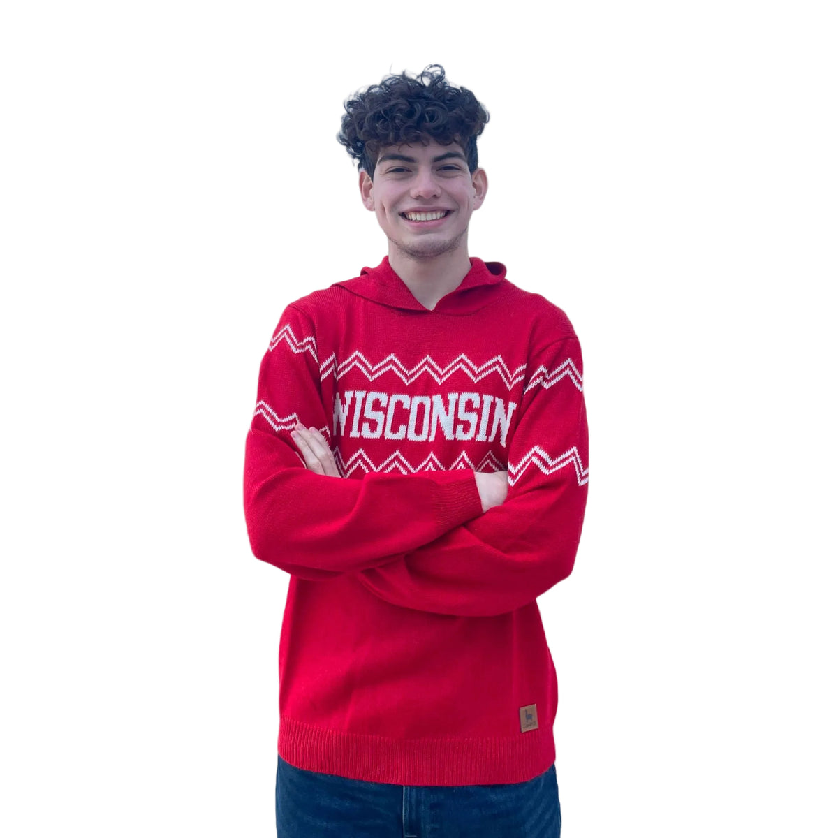 Person wearing a red 'Wisconsin' hoodie against a beige background