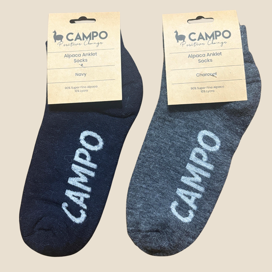 Two pairs of blue ankle socks with 'Campo' branding on a beige background