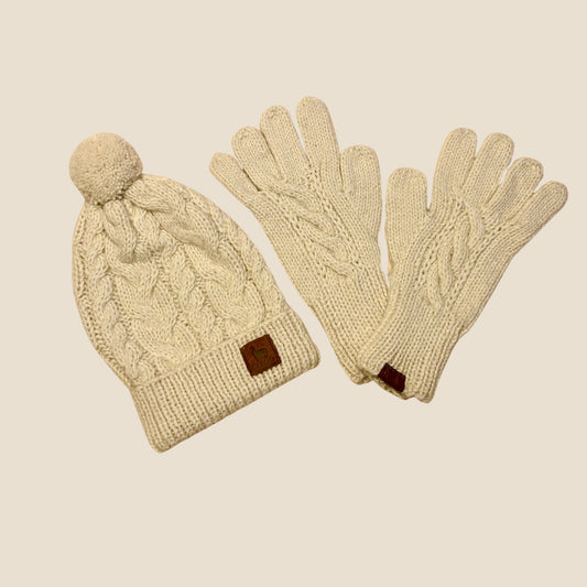 Knitted hat and gloves set on a beige background