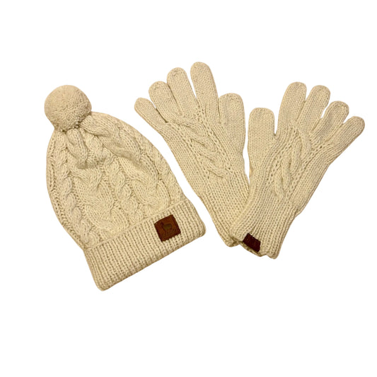 Knitted hat and gloves set on a beige background