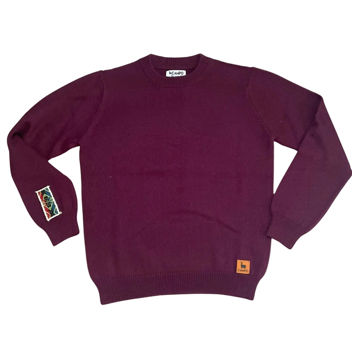 Eggplant sweater with small Campo logos on a beige background