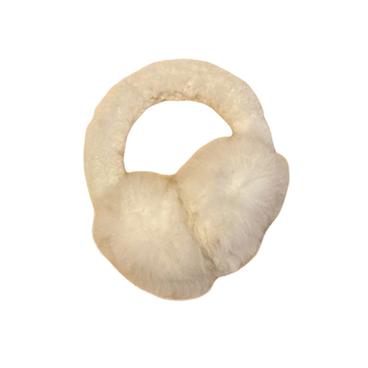 White ear muffs on a beige background