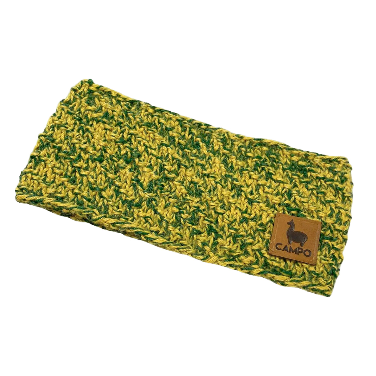 Green and yellow knitted headband with a brown leather patch on a beige background