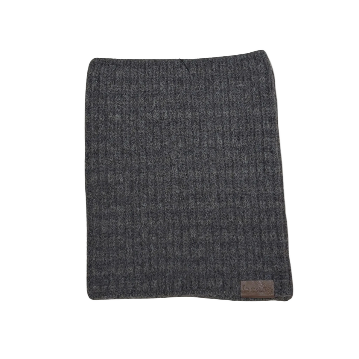 Gray textured blanket with a brand label on a beige background