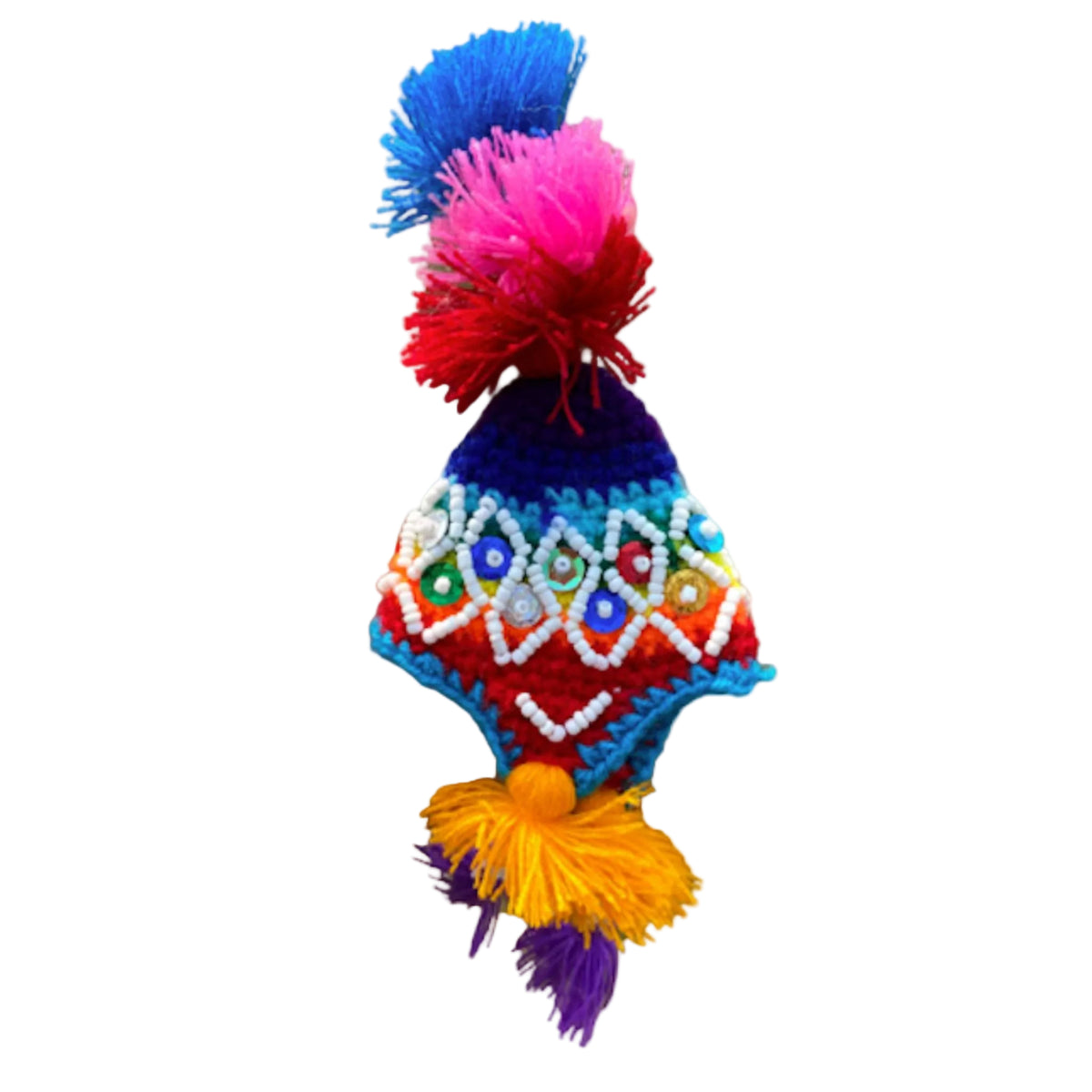Colorful knitted hat with pom-poms on a beige background
