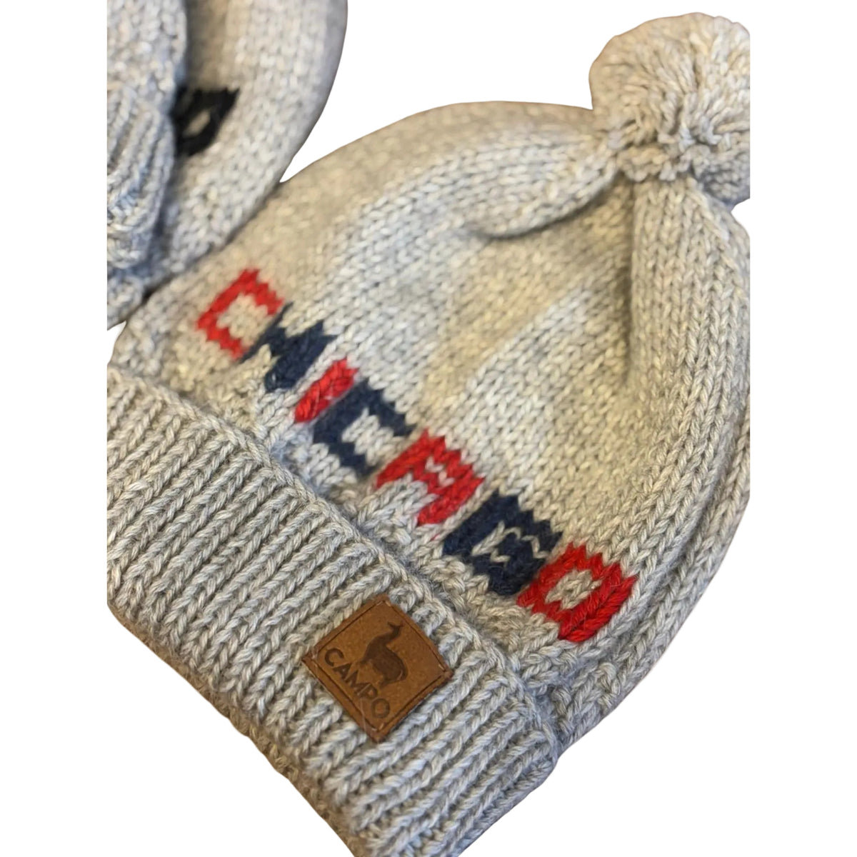 Knitted hat with 'CHICAGO' text and Campo logo on a beige background