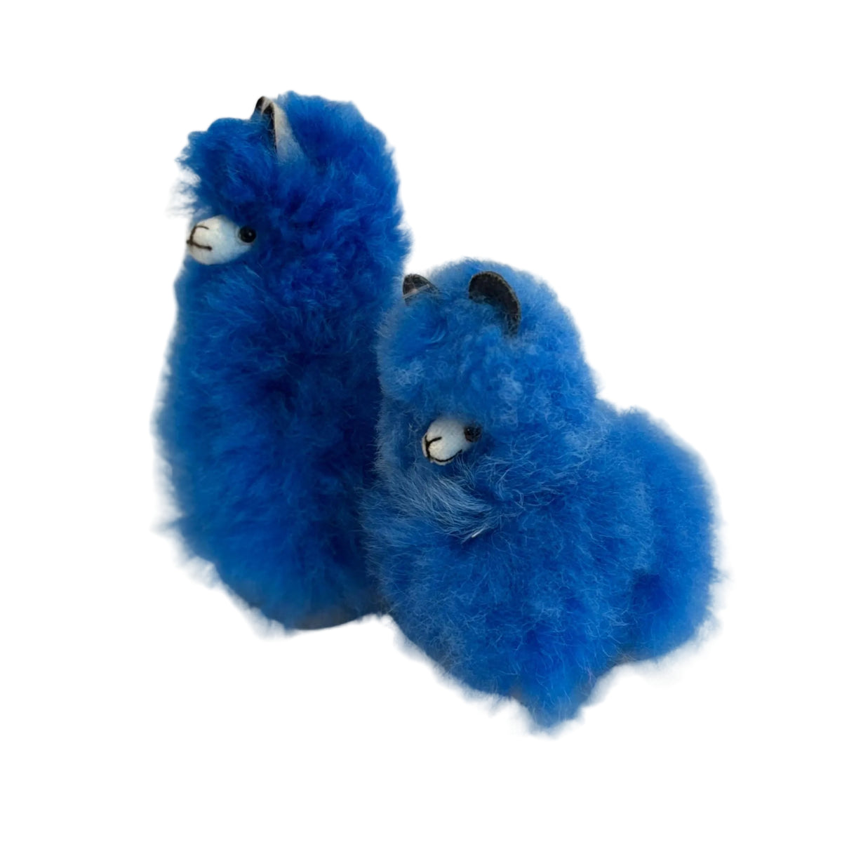 Two blue plush toys alpaca on a beige background
