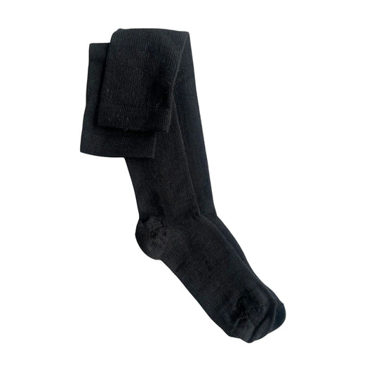 Black compression socks on a beige background