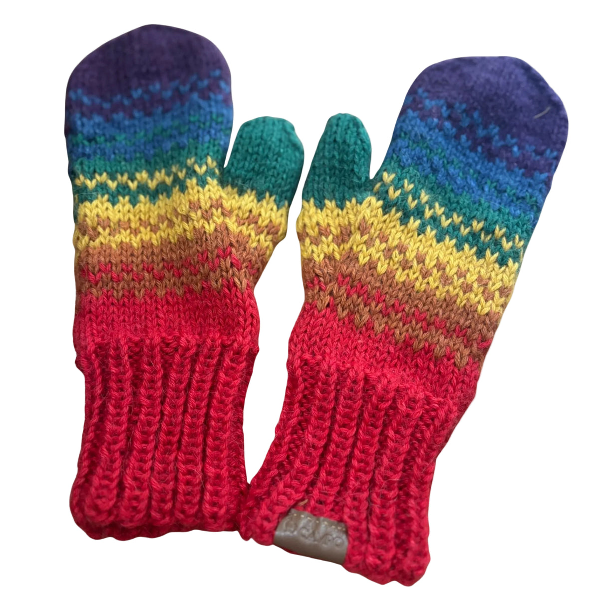 Pair of colorful knitted mittens with a rainbow pattern on a beige background