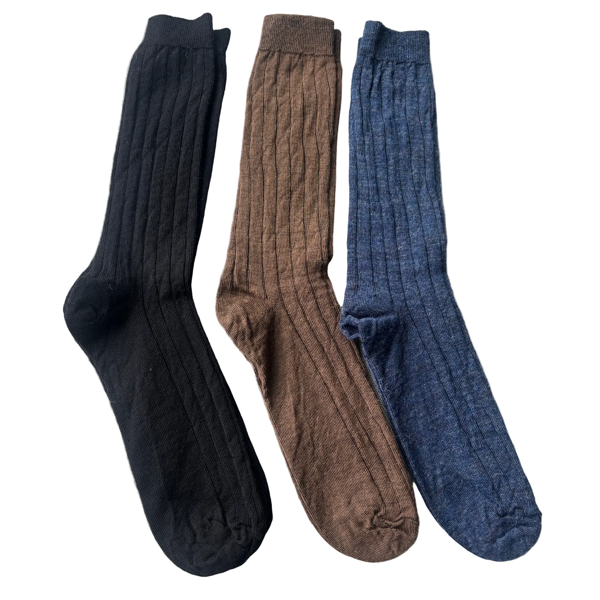 Three pairs of socks in blue, brown, and black on a beige background