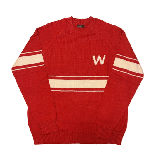 Red sweater with white stripes and a letter 'W' on a beige background