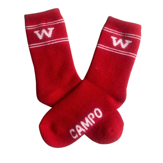 Red socks with white lettering on a beige background