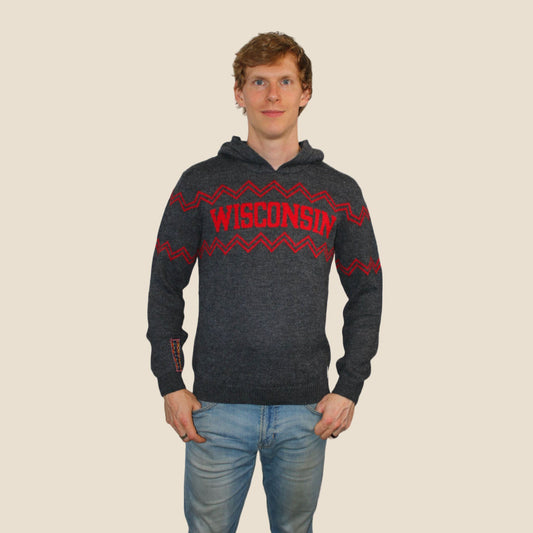 Person wearing a dark gray hoodie with red 'Wisconsin' text on a beige background