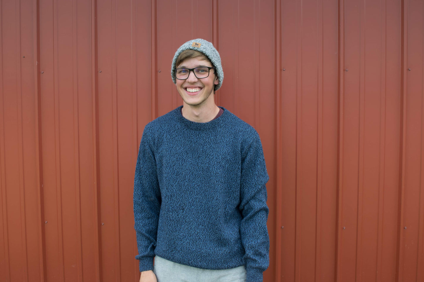 Man outside in blue alpaca crew neck sweater