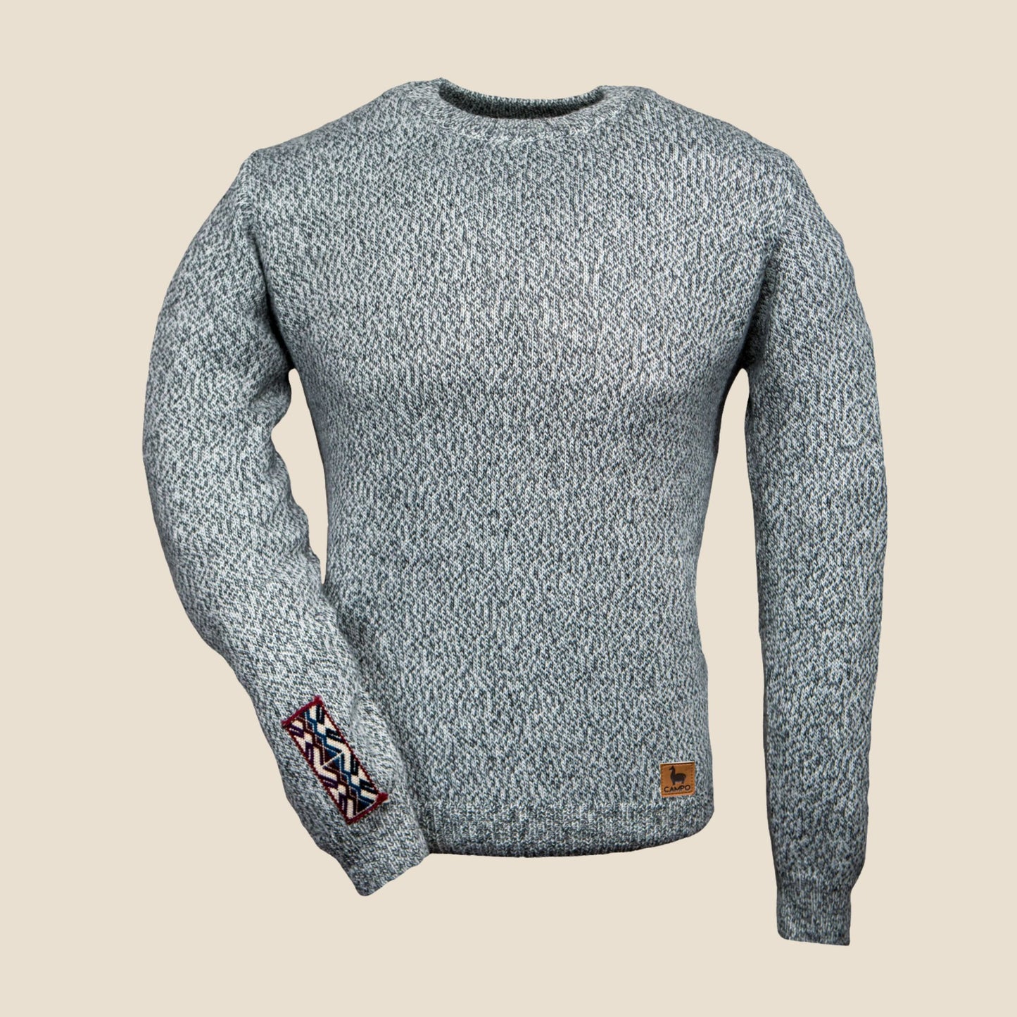 salty and pepper sweater with patterned sleeve on a beige background