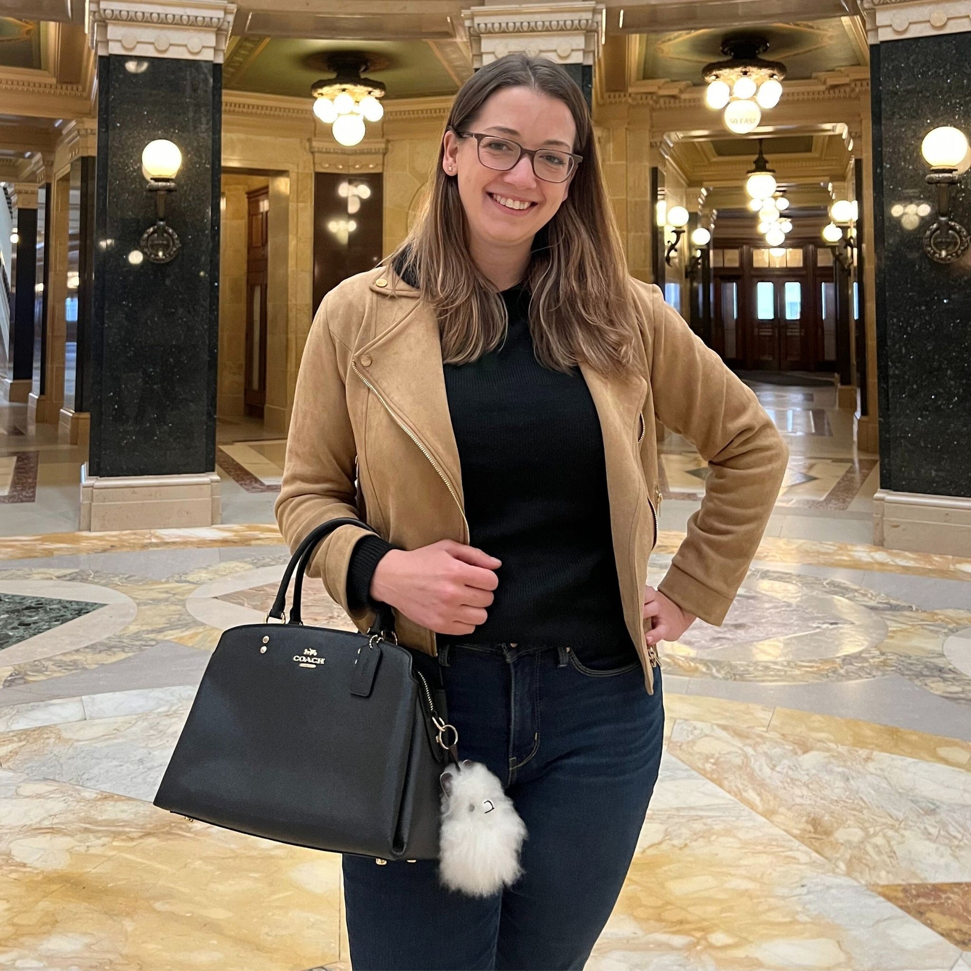 Woman in a beige coat with black alpaca inner