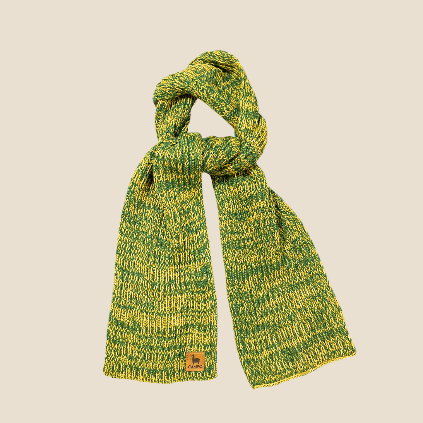 A green and yellow knitted scarf with a textured pattern, displayed on a plain background.