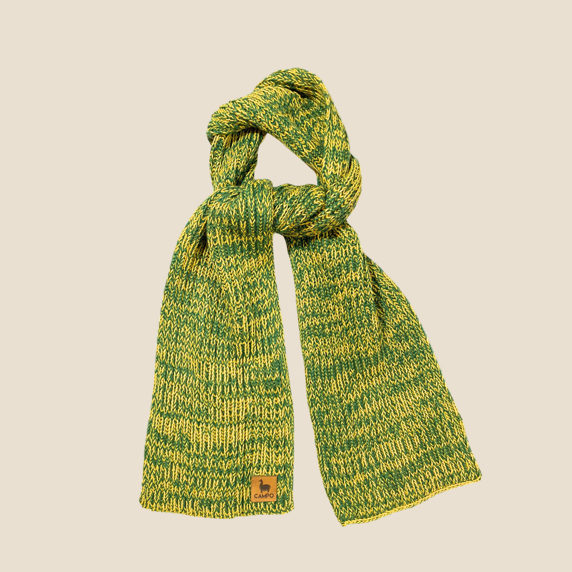 A green and yellow knitted scarf with a textured pattern, displayed on a plain background.