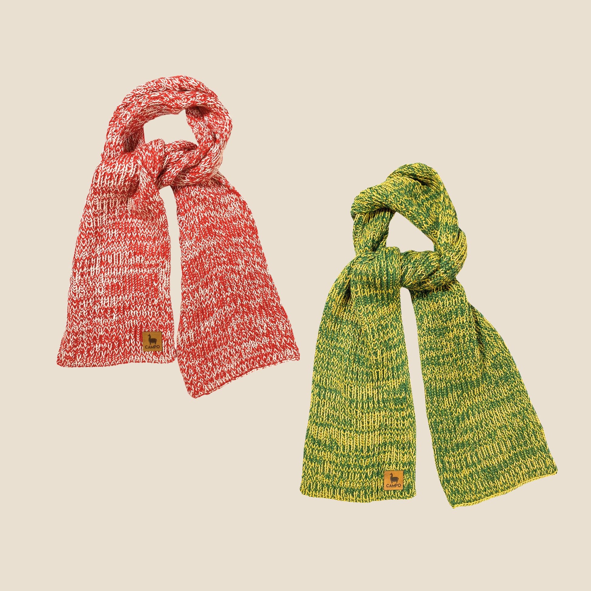 Two knitted scarves, one red and one green, on a beige background.
