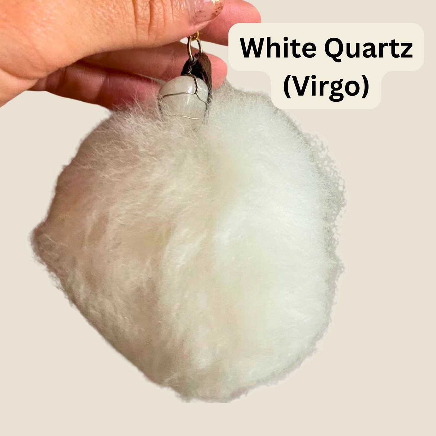 White crystal held by a hand with 'White Quartz (Virgo)' text on a beige background