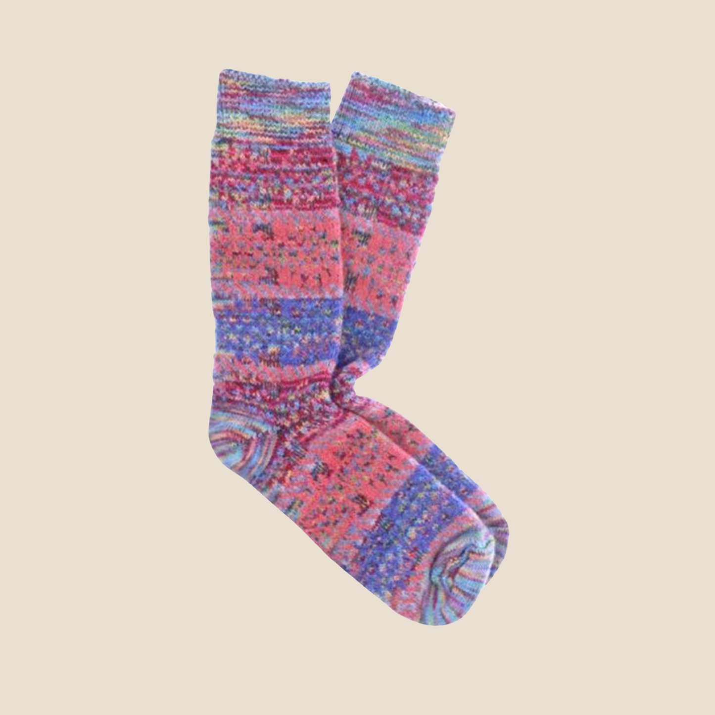 Pair of candy socks on a beige background