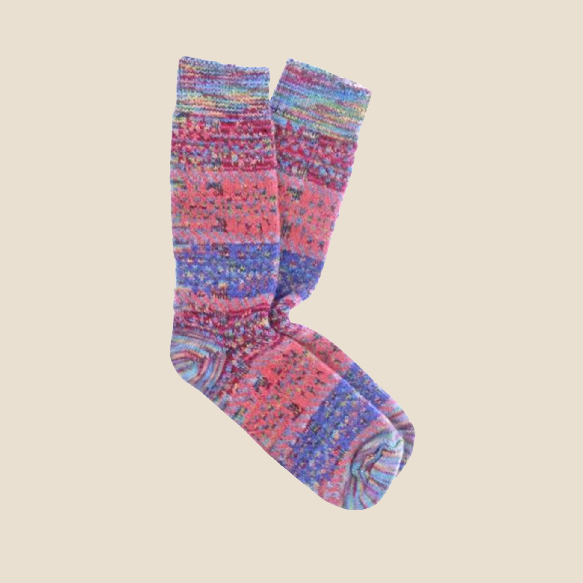 Pair of candy socks on a beige background