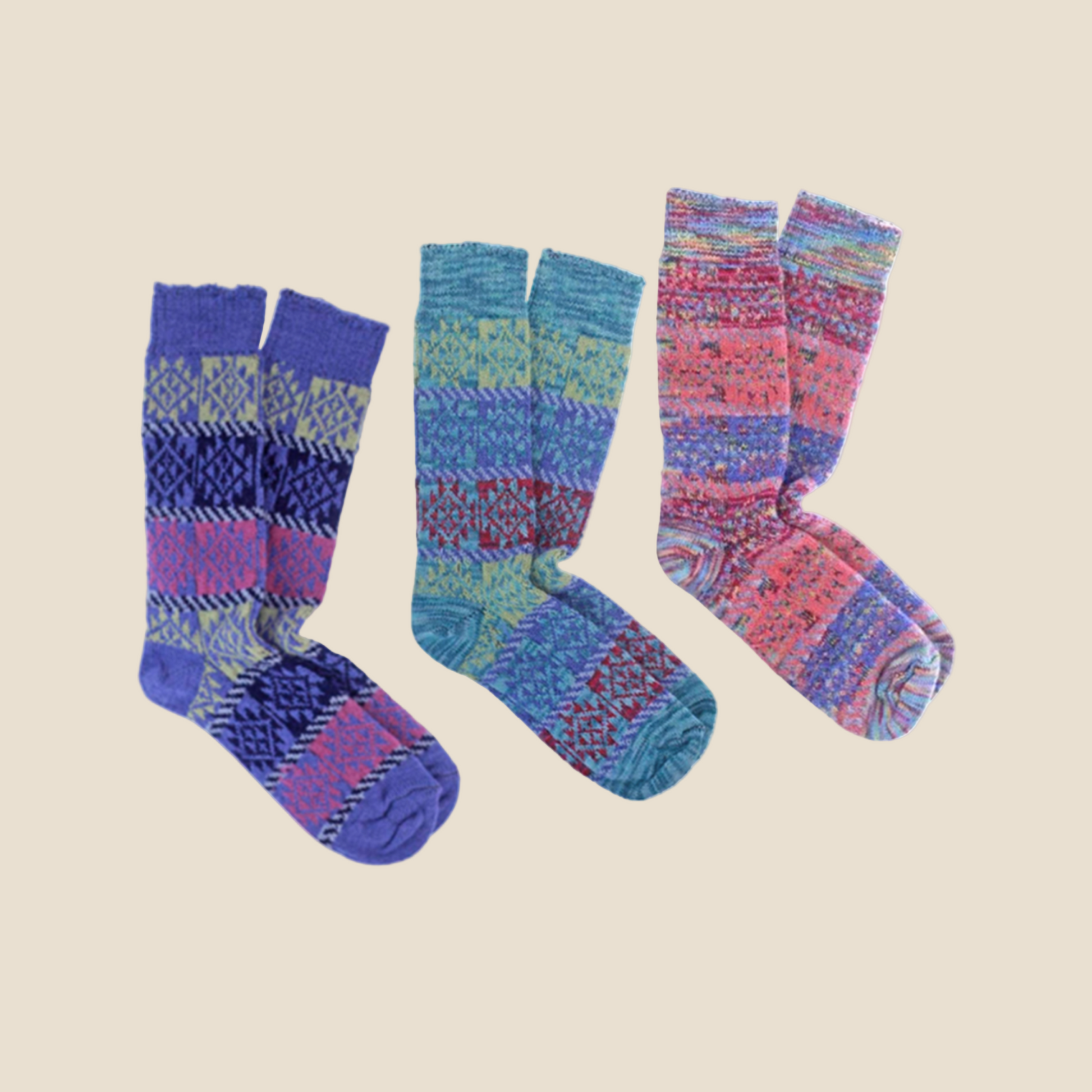 A set of colorful alpaca fiber socks with geometric patterns, displayed in three different designs.