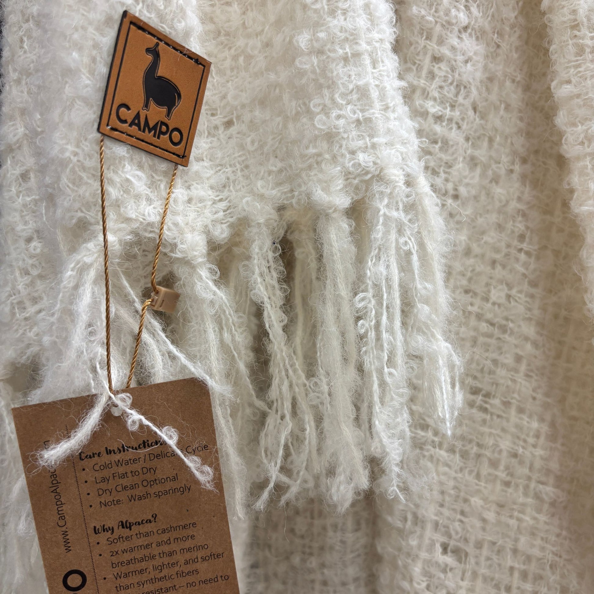 Textile product with 'Campo' label and care instructions tag on a textured background