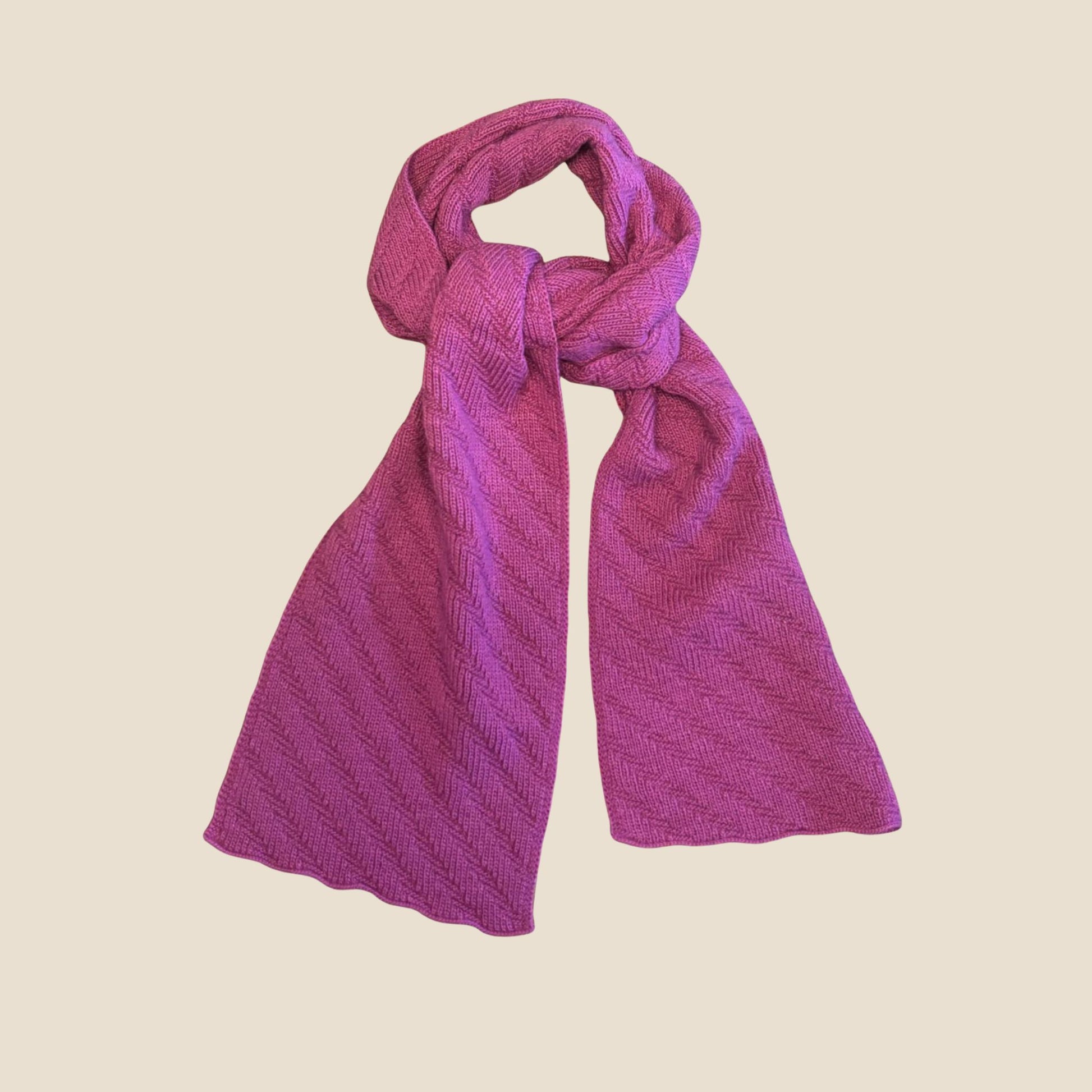 Fuchsia scarf on a beige background