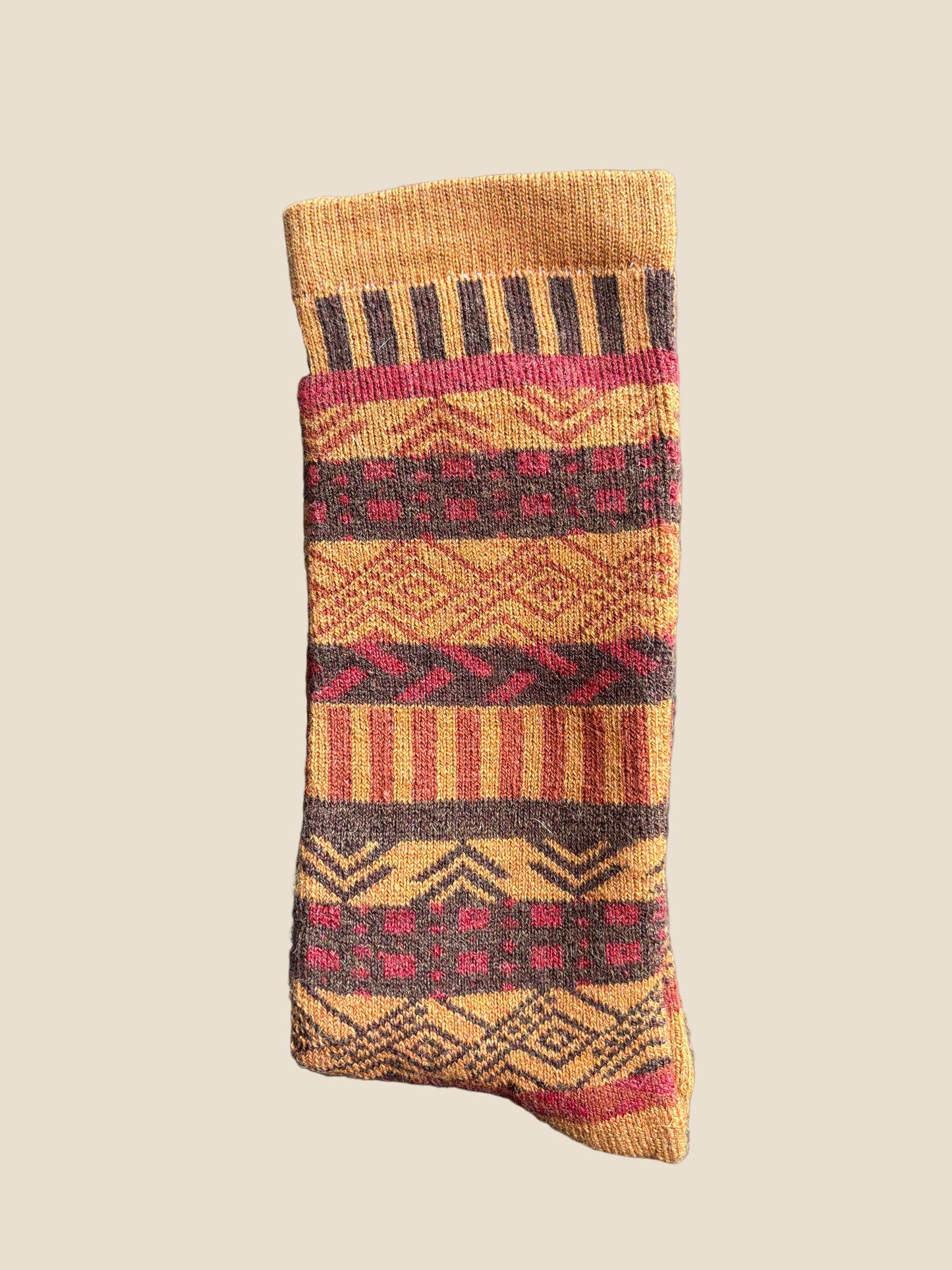 Patterned sock on a dark textured surface