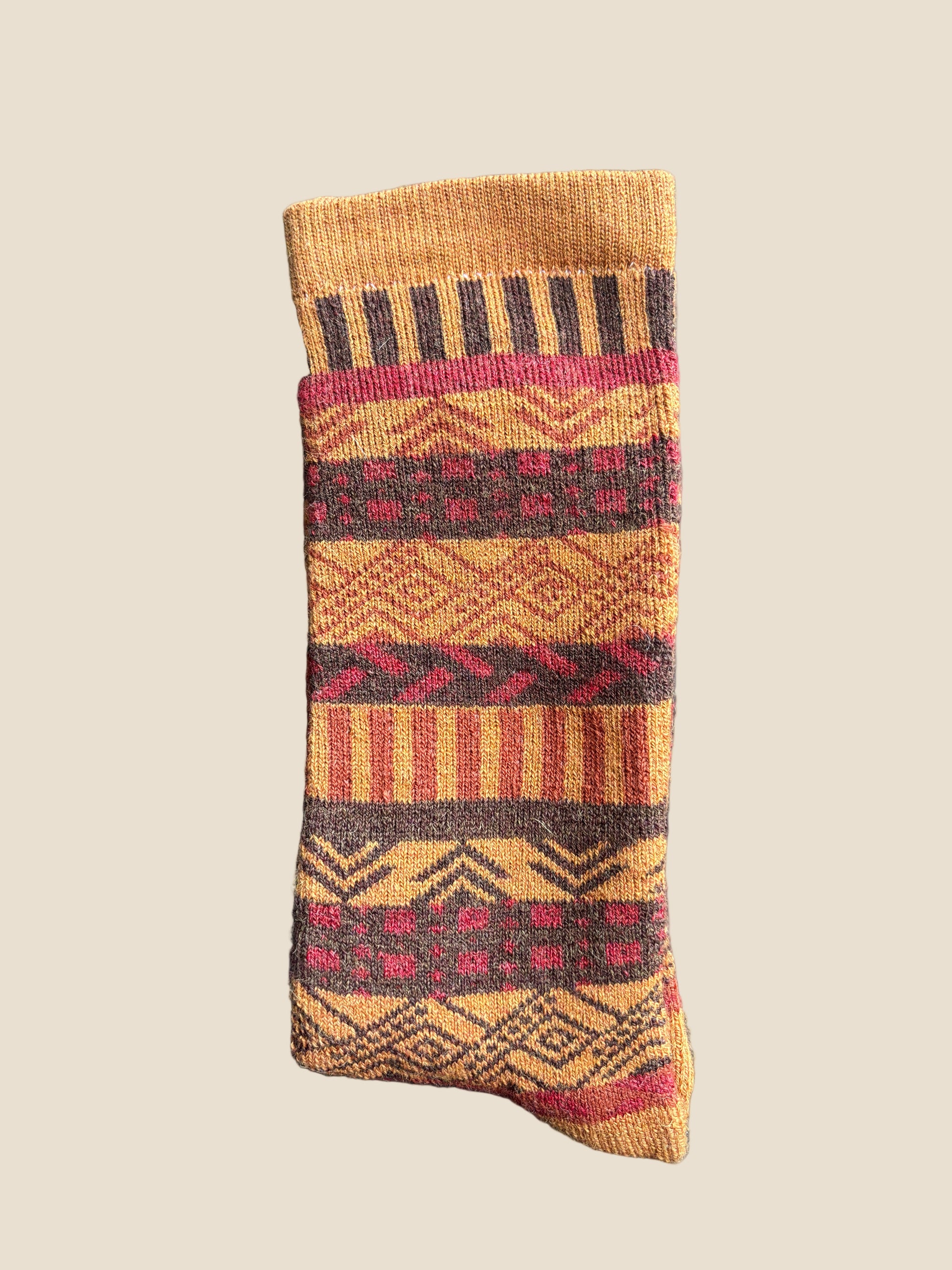 Patterned sock on a dark textured surface
