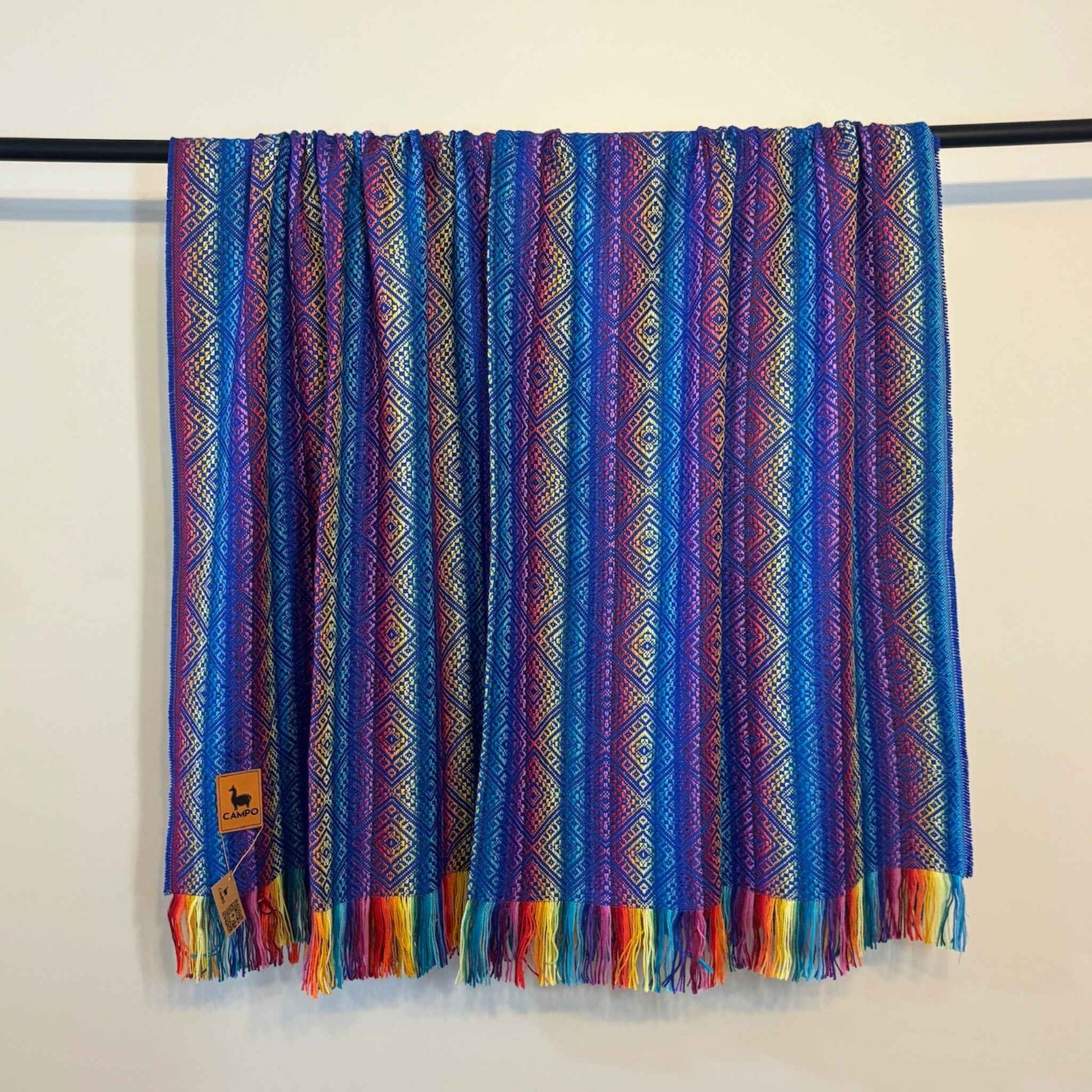 Blue Rainbow patterned scarf with rainbow fringes on a white background
