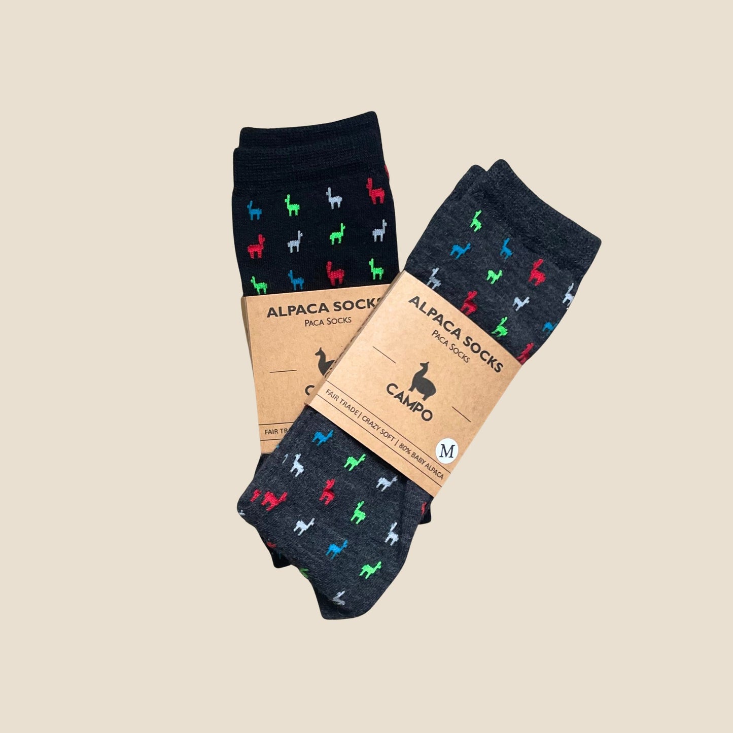 Three pairs of alpaca-themed socks with patterned design on a beige background