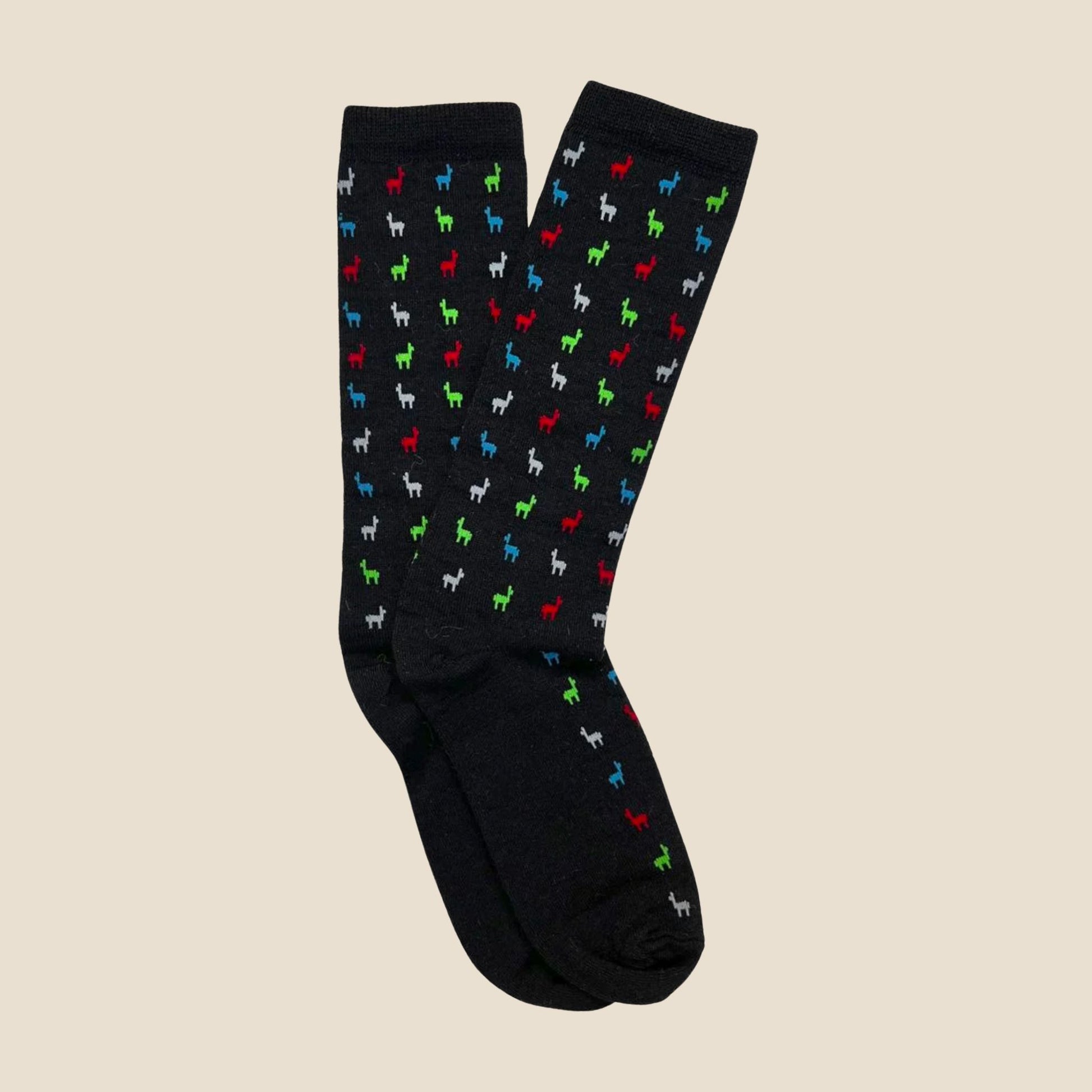 Black socks with colorful alpaca pattern on a beige background