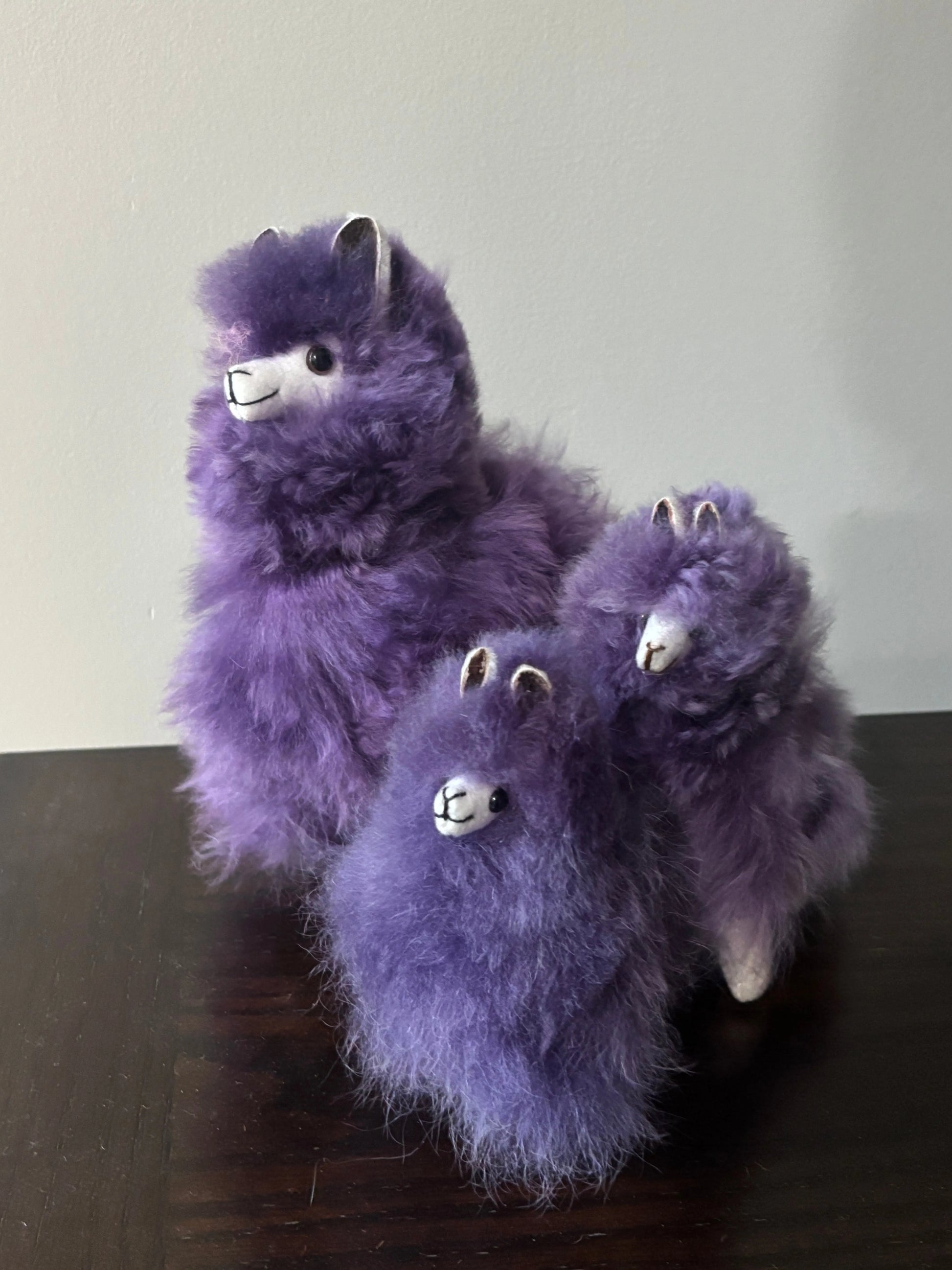 3 sizes of purple alpaca fluffies:  Small, Medium, Large