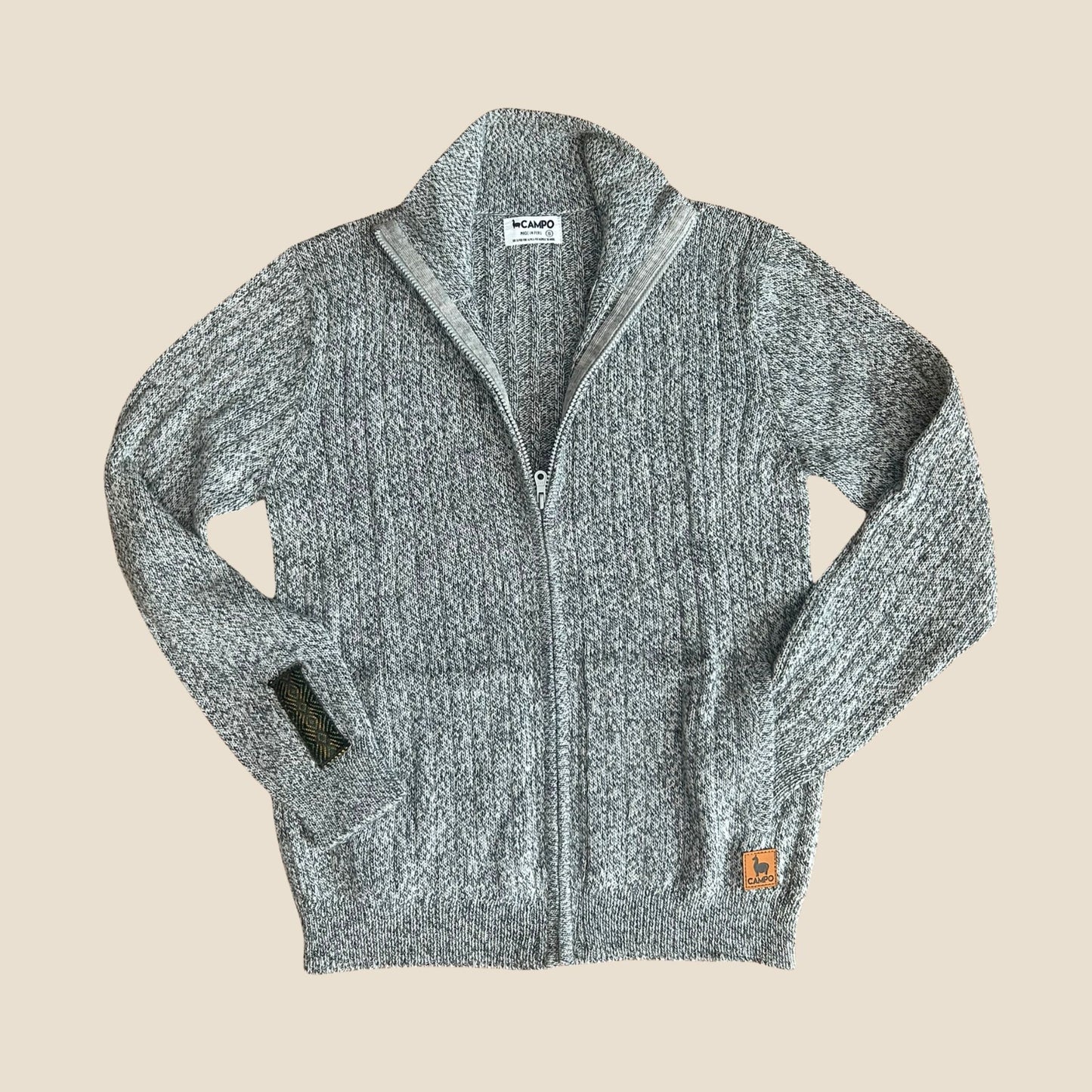 Salt and pepper zip-up sweater with Campo logo on a beige background