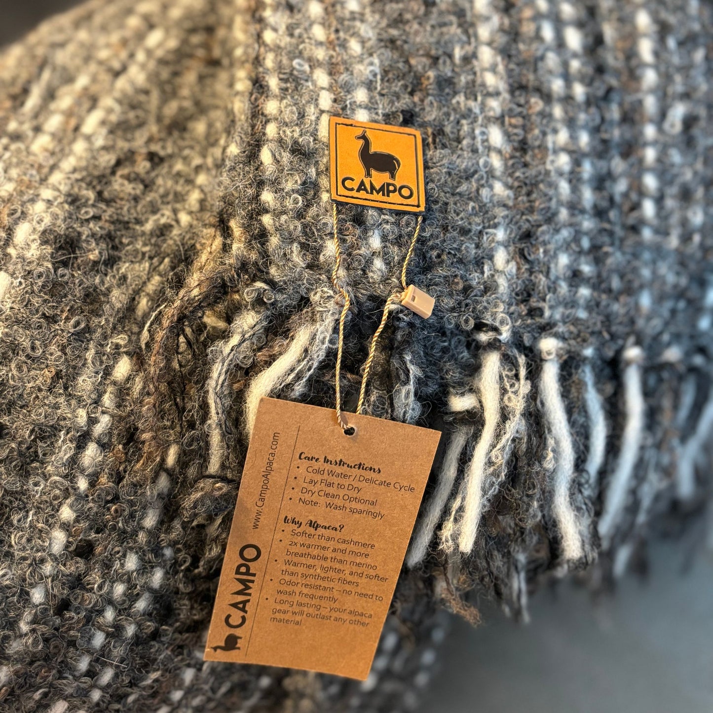 Textile product with 'Campo' brand tag and label on a textured fabric background