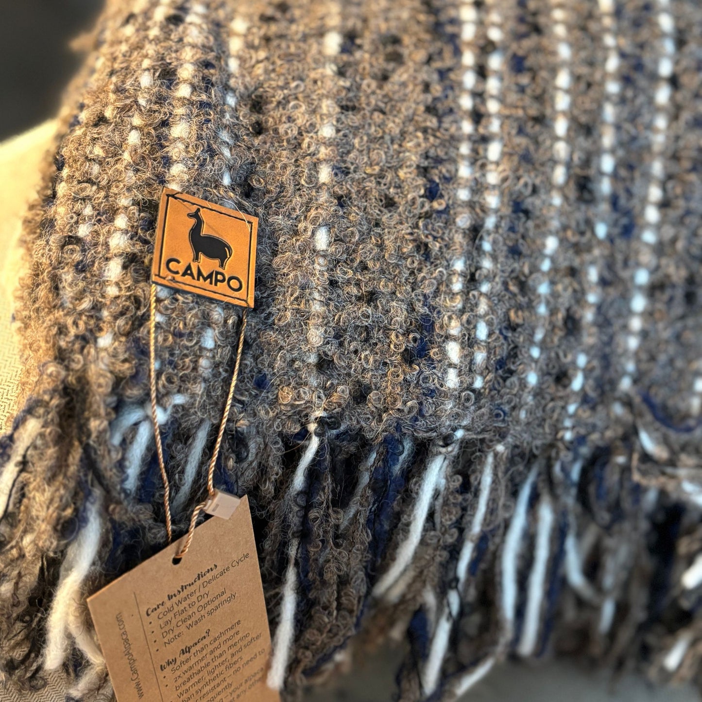 Textured fabric with a 'Camilo' brand tag