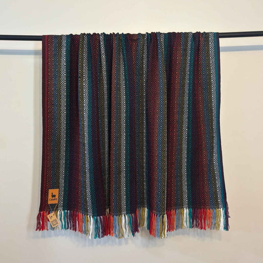 Black multi with colorful pattern and fringes on a white background