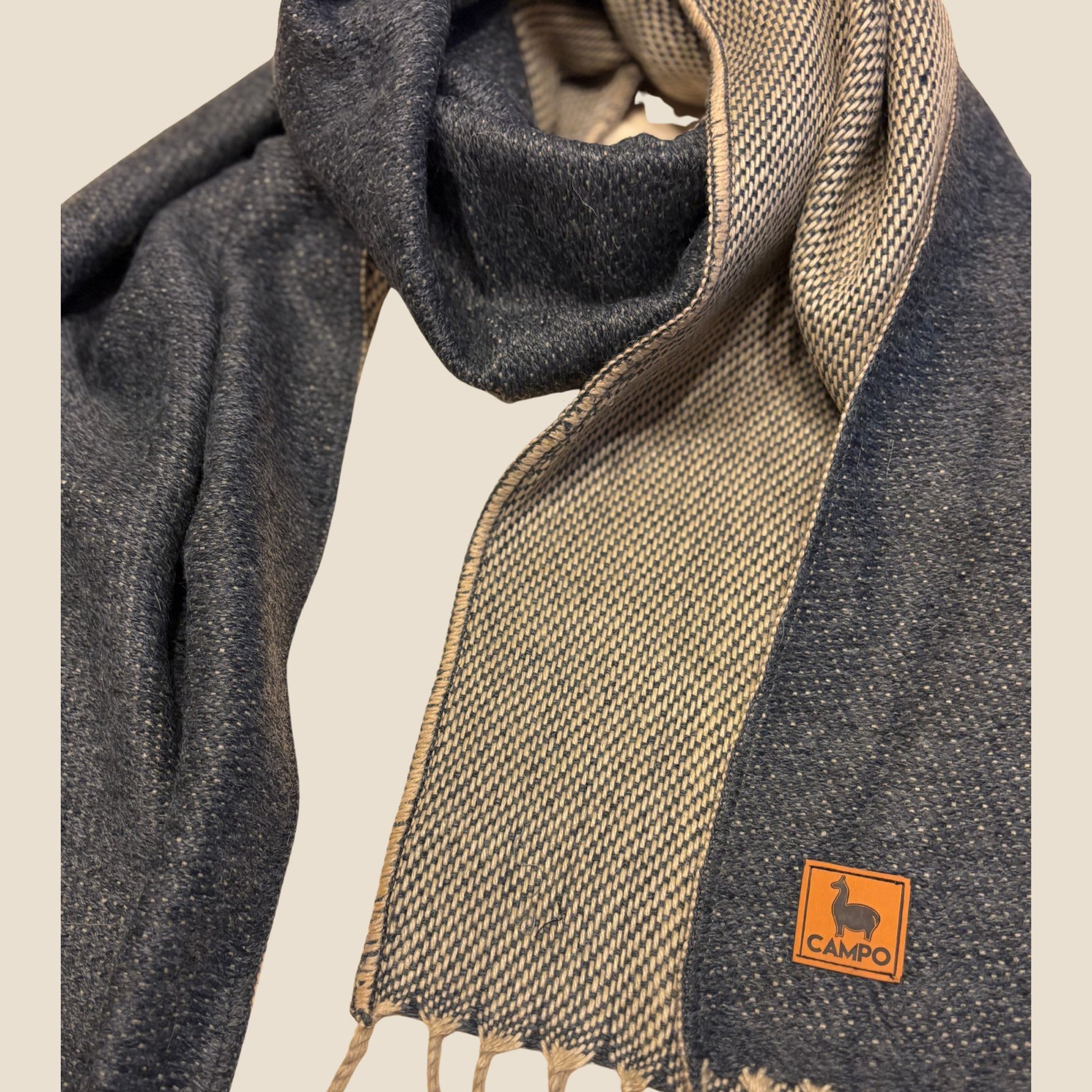 Scarf with a visible brand logo on a neutral background