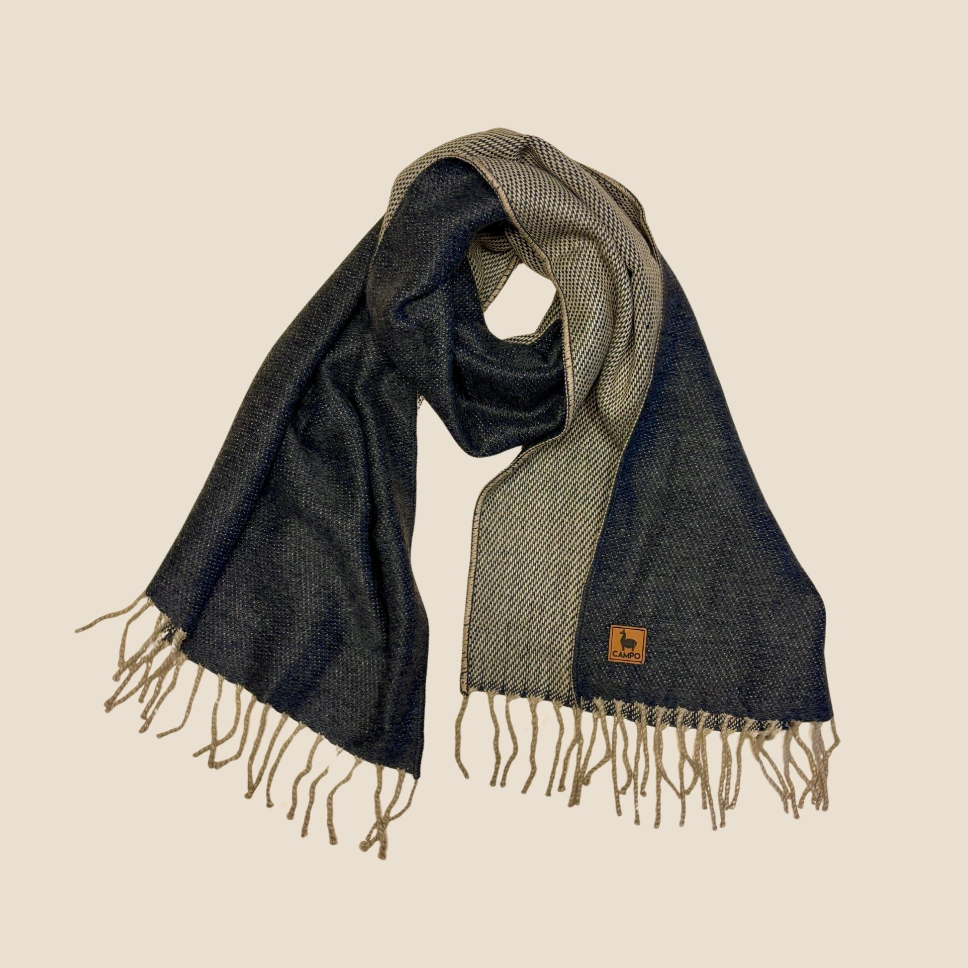 Woven scarf with fringes on a beige background