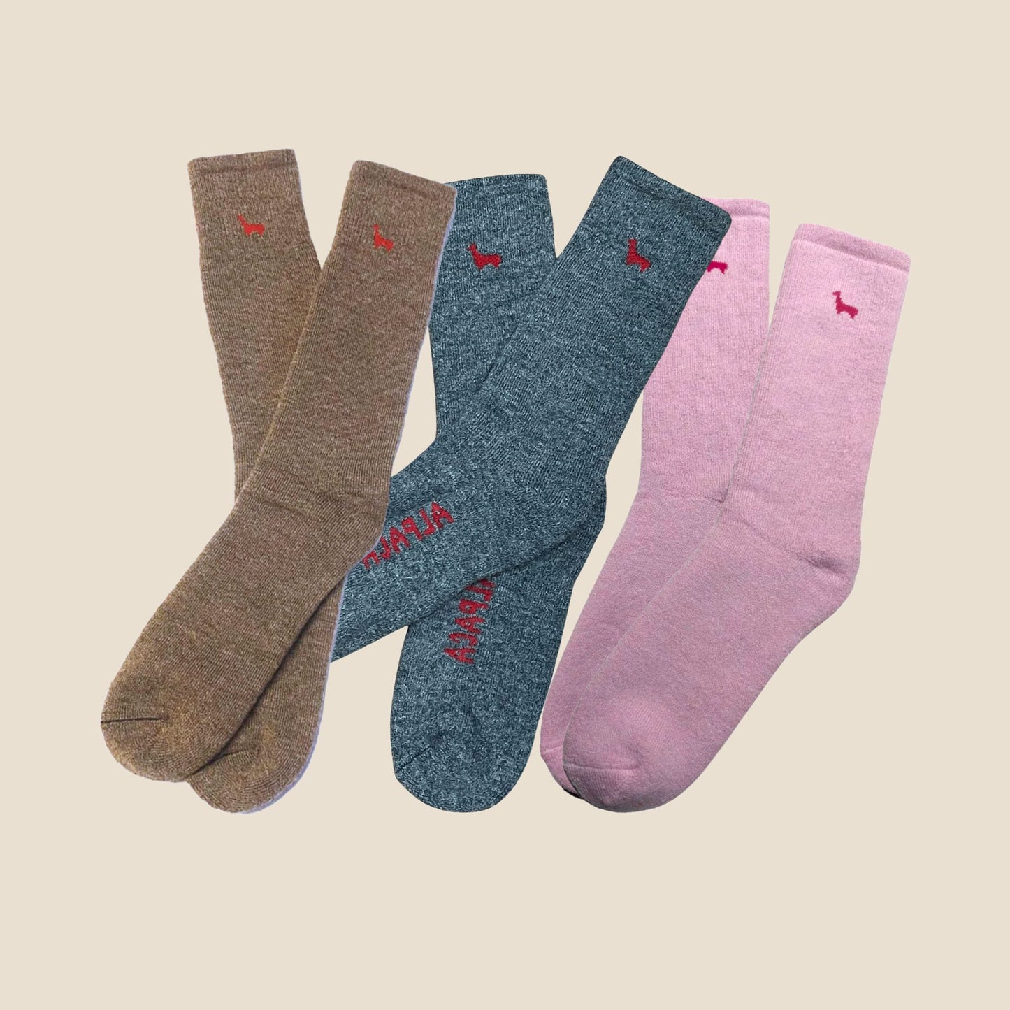 Three pairs of socks on a beige background