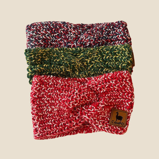 Stack of three twisted headbands in red, green, and multicolor on a beige background with 'Campo' brand label.
