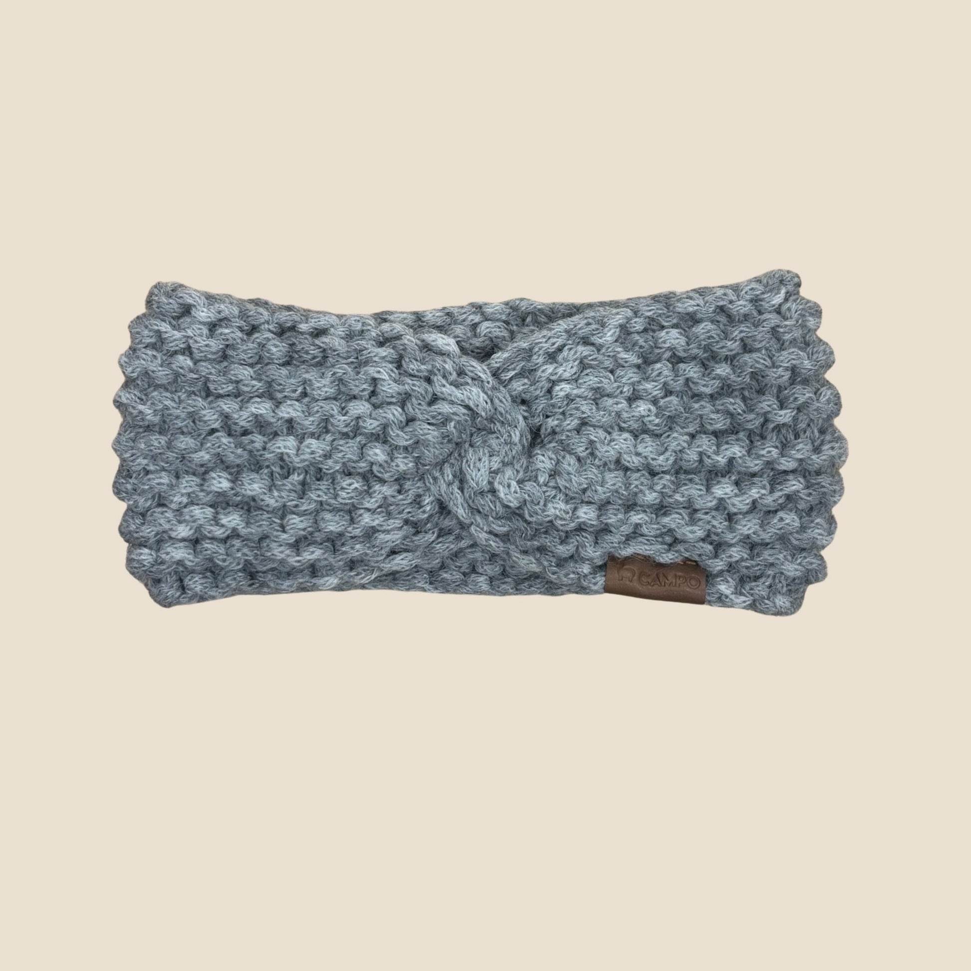 Dark Gray headband with a knot on a beige background