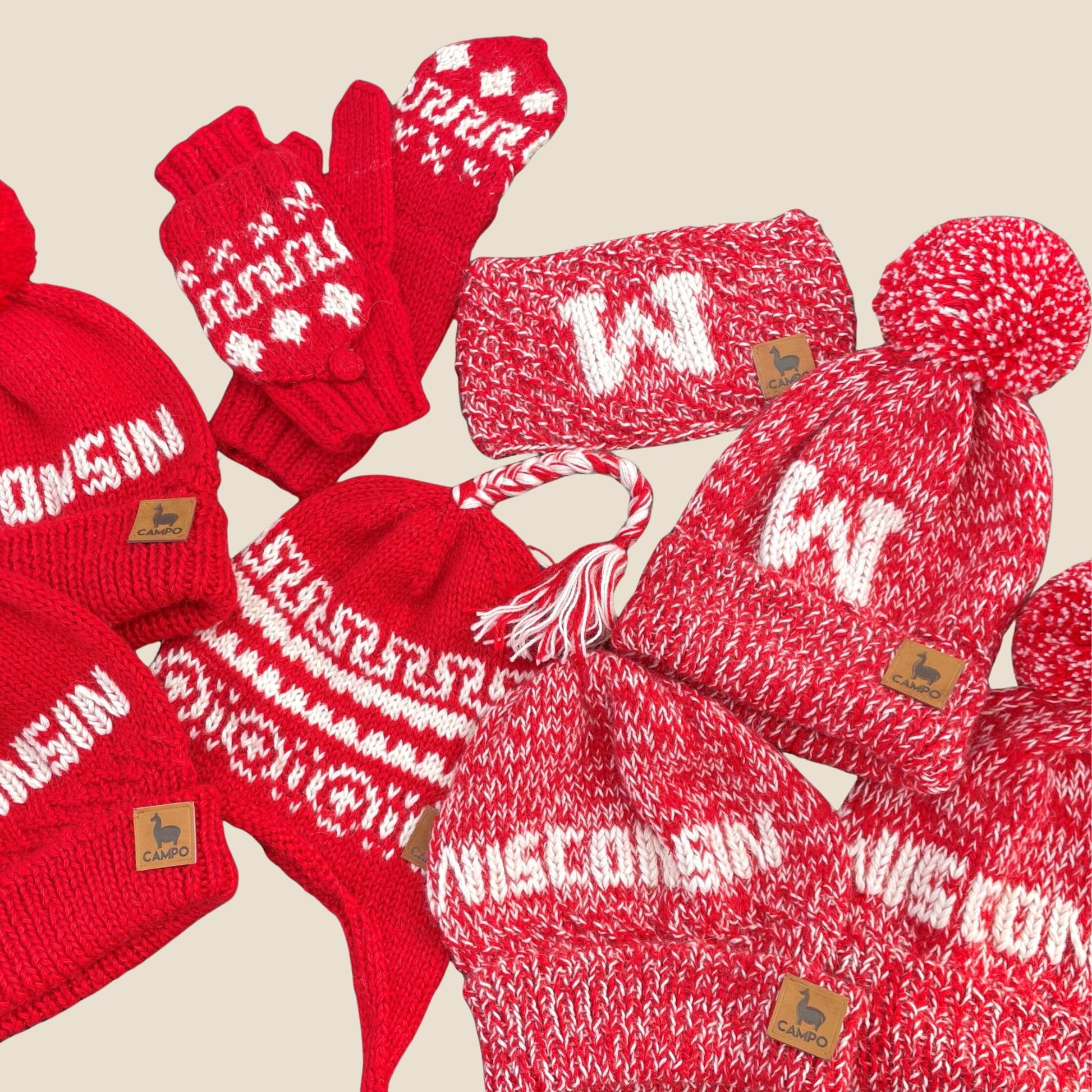 Collection of red and white winter accessories including hats, scarves, and gloves with 'Wisconsin' text on a beige background.