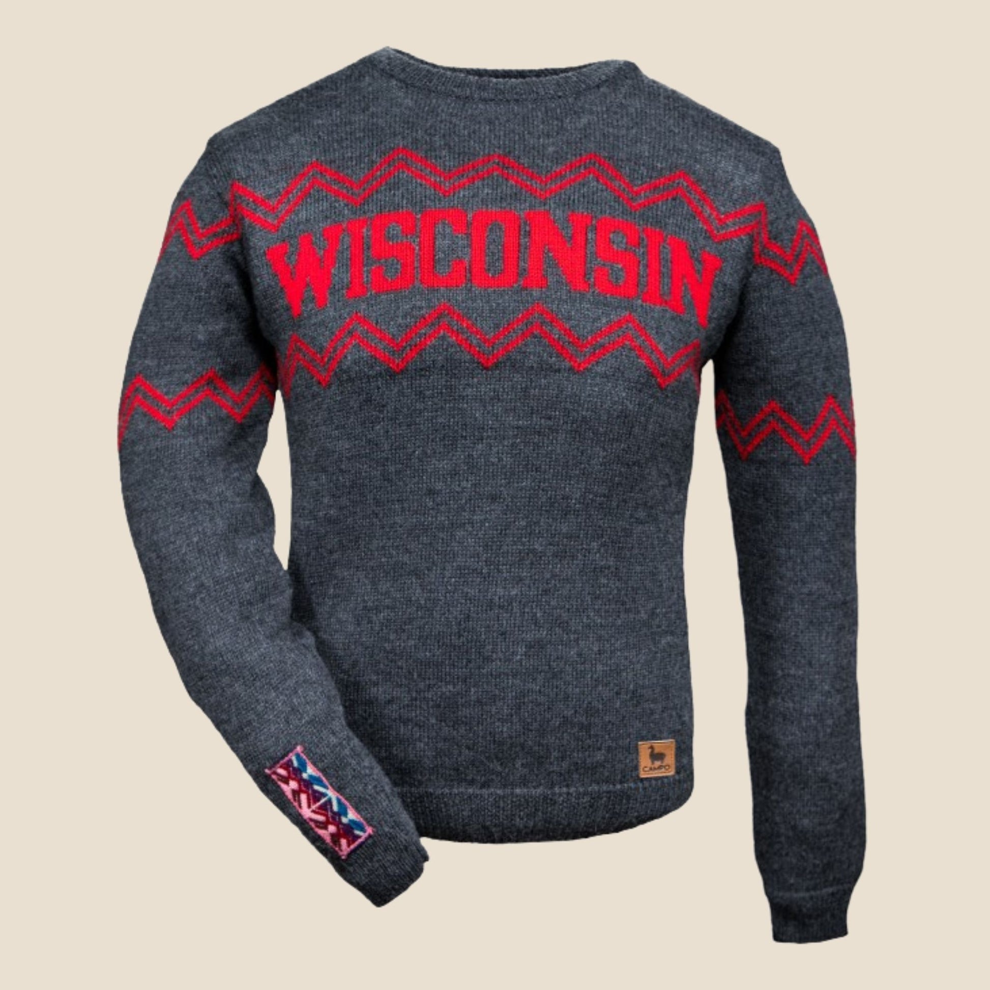 Gray sweater with red 'Wisconsin' text and zigzag patterns on a beige background