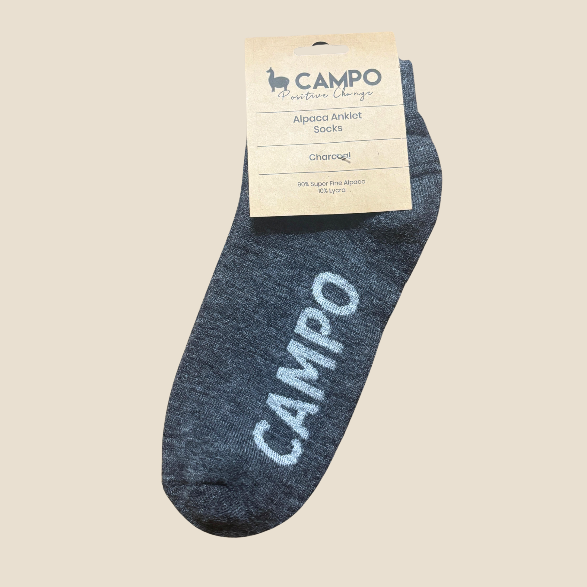 Charcoal ankle sock with 'Campo' branding on a beige background
