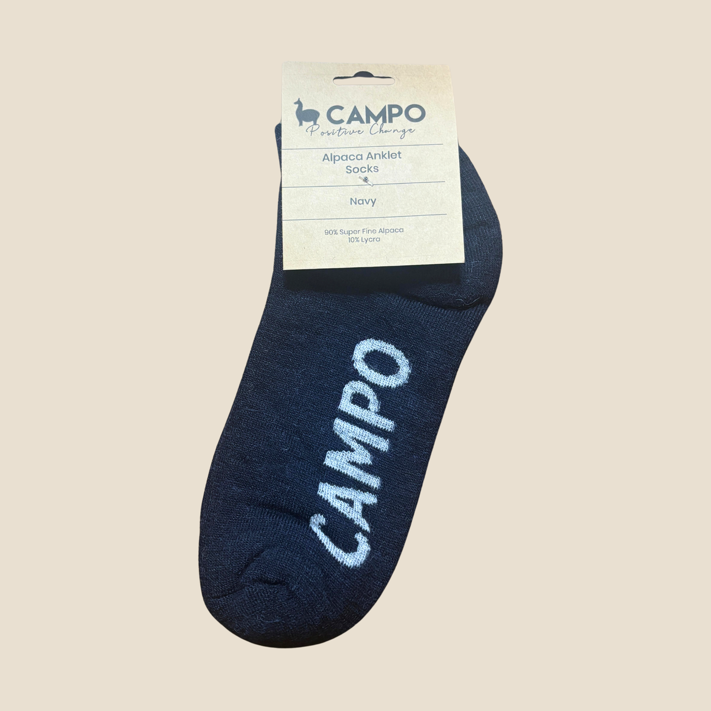 Navy ankle sock with 'Campo' branding on a beige background